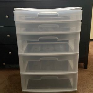 White plastic storage drawer with 5 compartments.